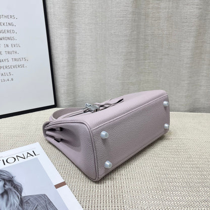 Sac à main HM Kelly 25 cm en cuir Togo mauve rose pâle et accessoires argentés
