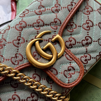 GG Marmont 26 cm en toile monogramme bleu chocolat avec finitions dorées
