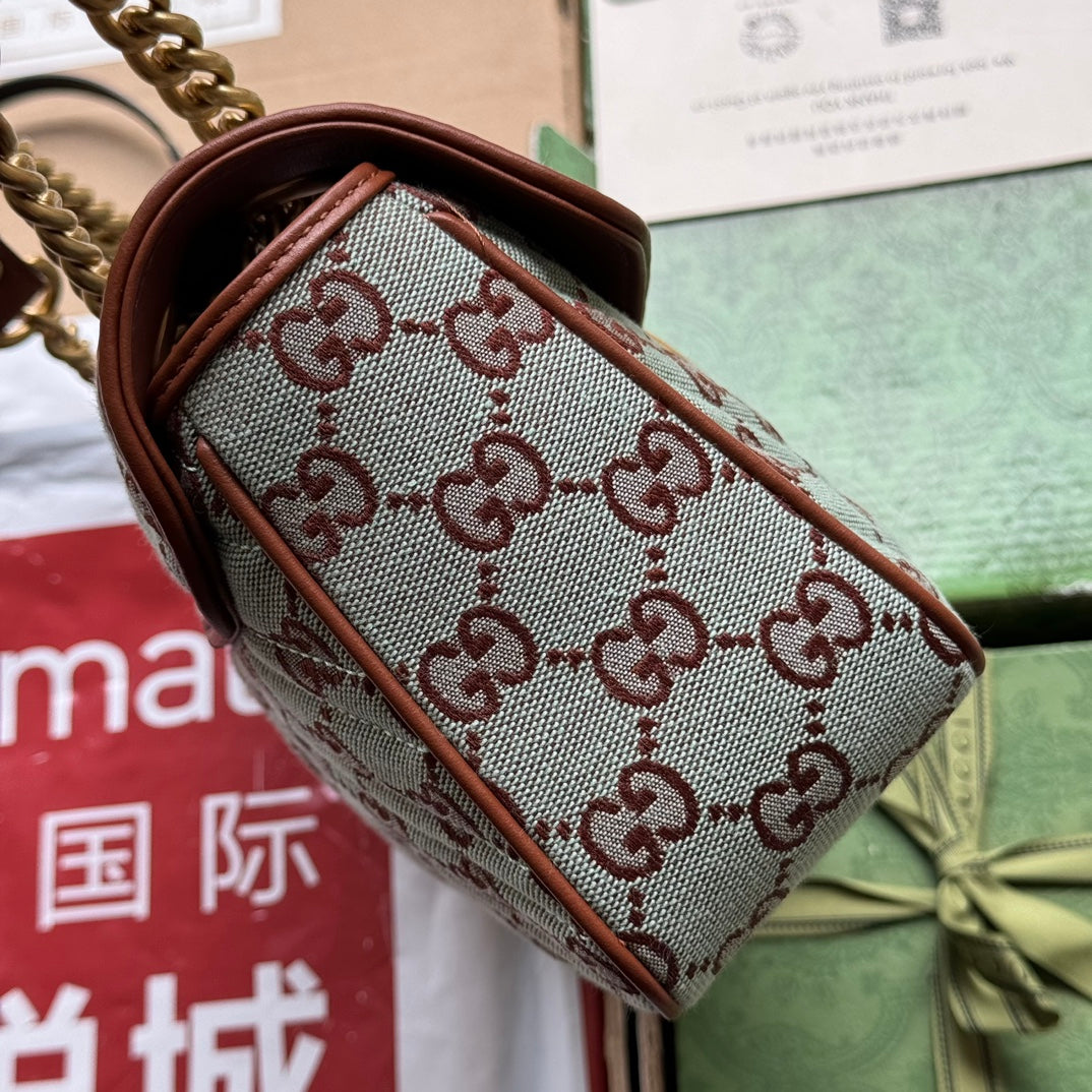 GG Marmont 26 cm en toile monogramme bleu chocolat avec finitions dorées