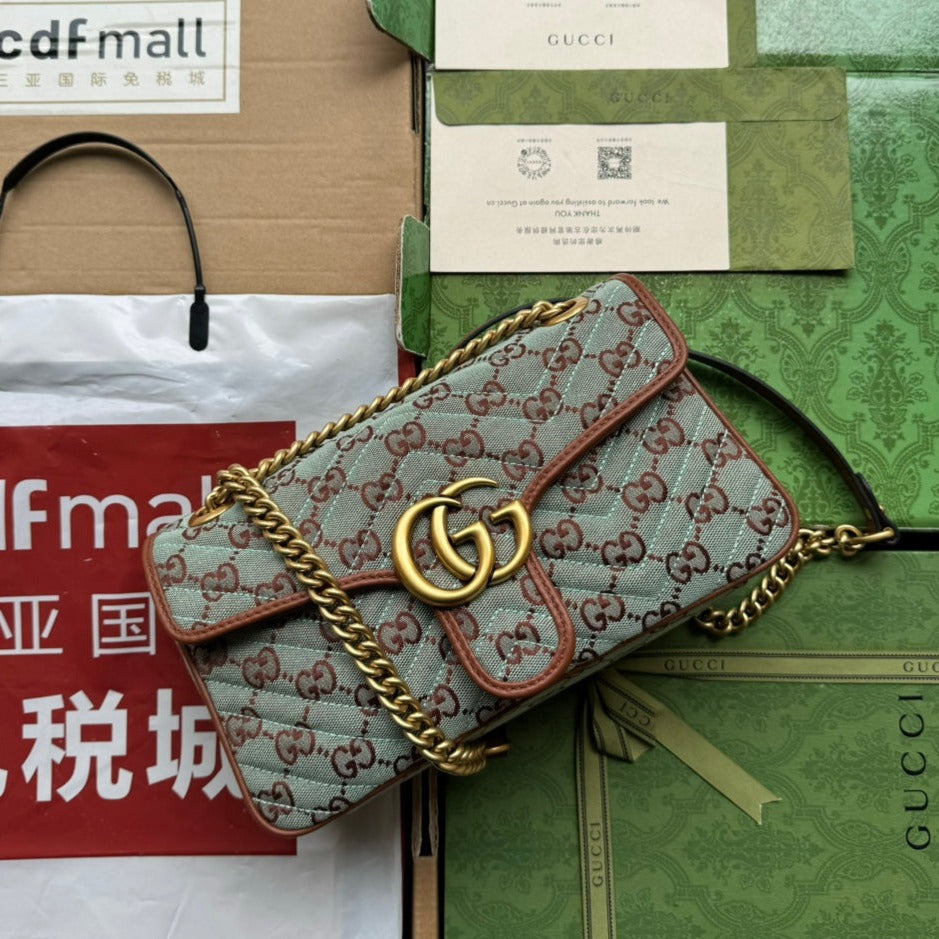 GG Marmont 26 cm en toile monogramme bleu chocolat avec finitions dorées