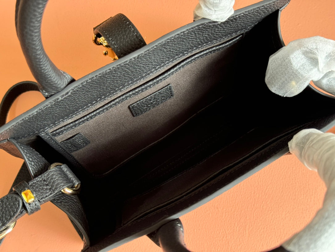 Petit sac fourre-tout Jackie 24 en cuir de veau noir et métal doré