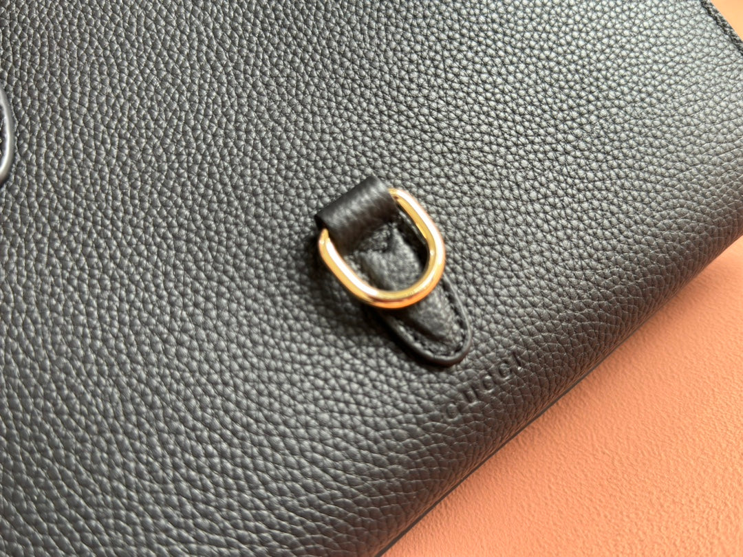 Petit sac fourre-tout Jackie 24 en cuir de veau noir et métal doré