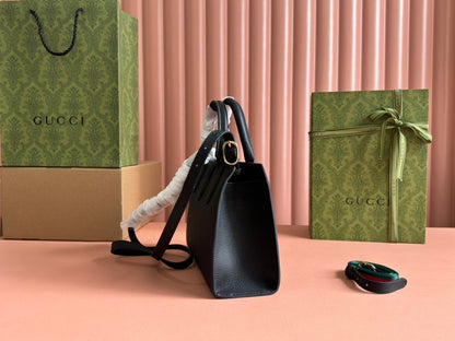 Petit sac fourre-tout Jackie 24 en cuir de veau noir et métal doré