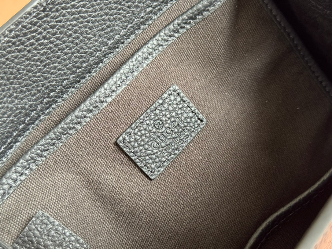 Petit sac fourre-tout Jackie 24 en cuir de veau noir et métal doré