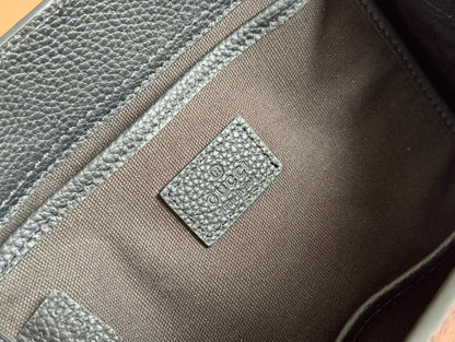 Petit sac fourre-tout Jackie 24 en cuir de veau noir et métal doré