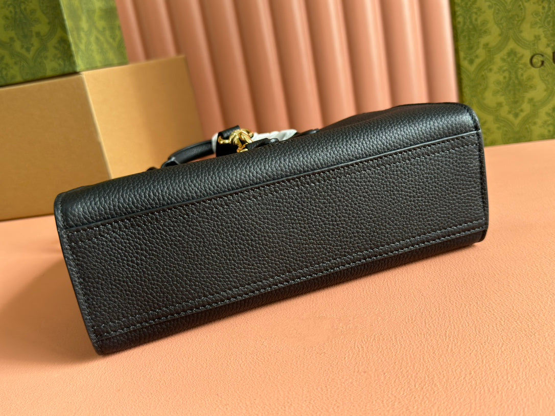 Petit sac fourre-tout Jackie 24 en cuir de veau noir et métal doré