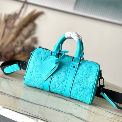 Sac bandoulière Keepall 25 en cuir de veau embossé monogramme bleu turquoise