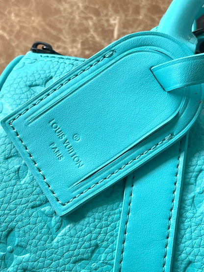 Sac bandoulière Keepall 25 en cuir de veau embossé monogramme bleu turquoise