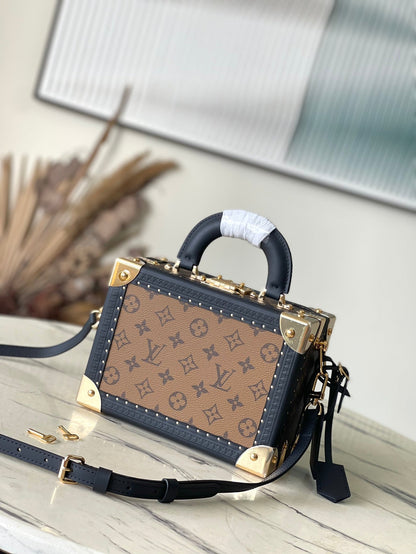 PETITE VALISE 22 IN BROWN MONOGRAM REVERSE CANVAS AND BLACK CALFSKIN TRIM GOLD HARDWARE