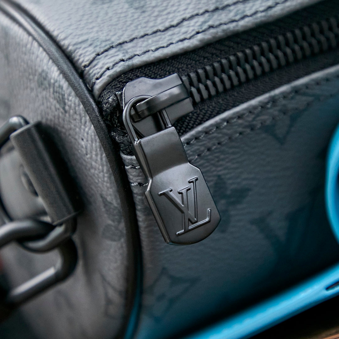 Sac bandoulière Keepall 25 pouces en cuir de veau turquoise mélangé avec toile éclipse et monogramme Gun Metal