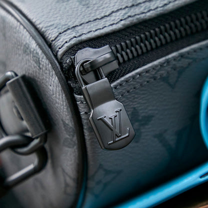 Sac bandoulière Keepall 25 pouces en cuir de veau turquoise mélangé avec toile éclipse et monogramme Gun Metal