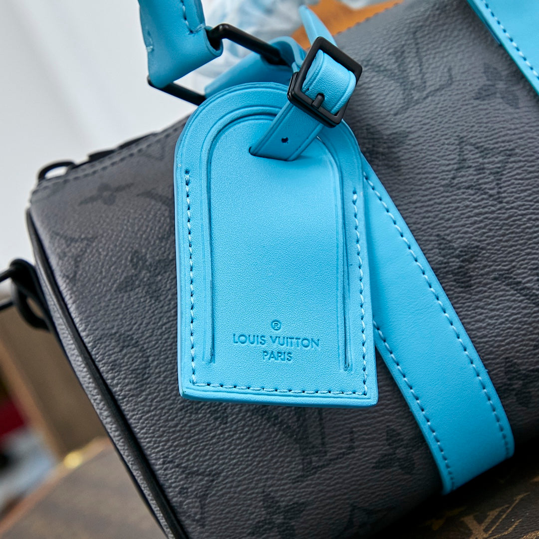 Sac bandoulière Keepall 25 pouces en cuir de veau turquoise mélangé avec toile éclipse et monogramme Gun Metal