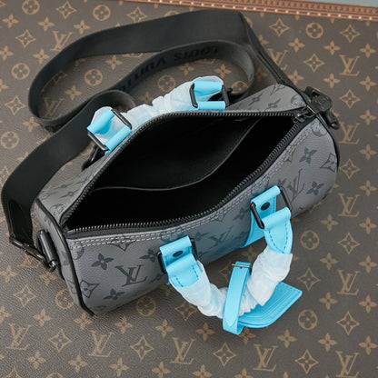 Sac bandoulière Keepall 25 pouces en cuir de veau turquoise mélangé avec toile éclipse et monogramme Gun Metal