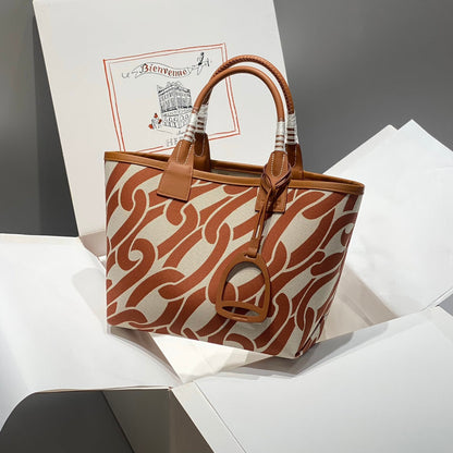 Sac HM Steeple 28 en cuir de veau marron et toile blanche et marron