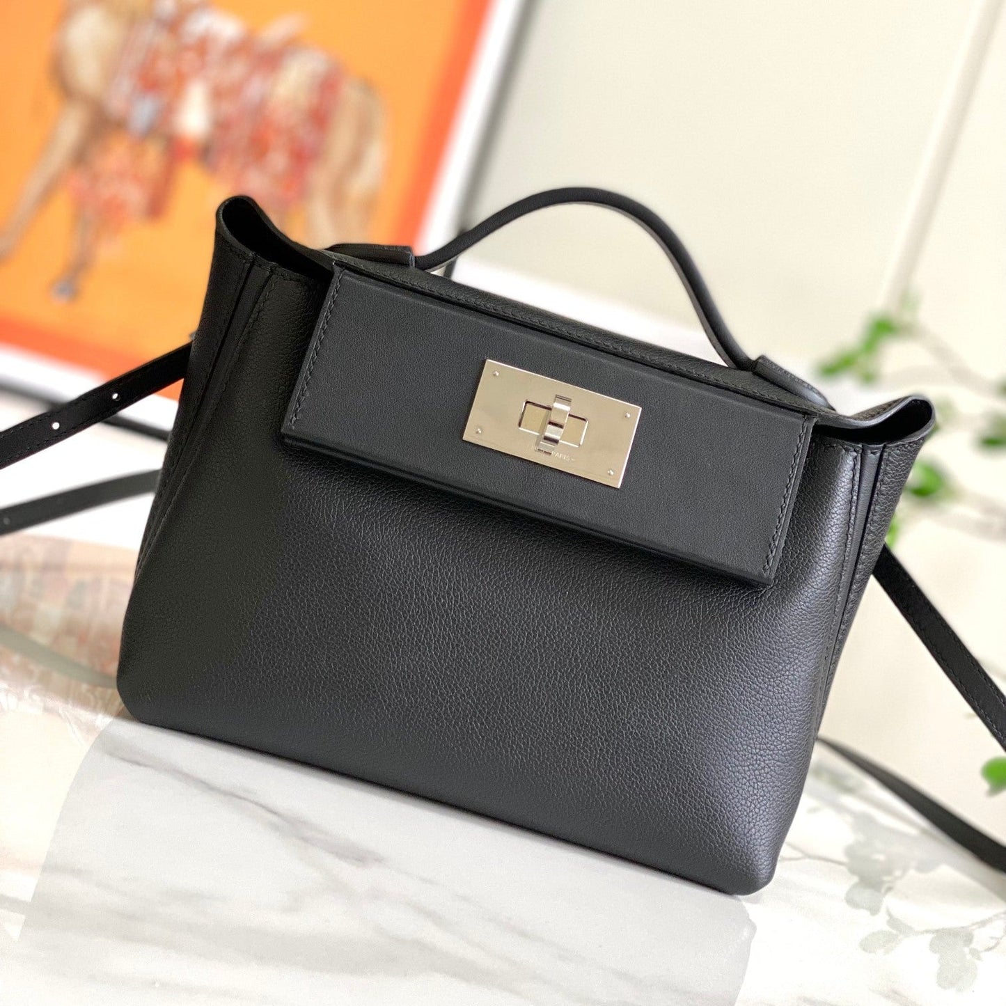 Mini sac HM 24/24 21 cm en cuir noir Evercolor, accessoires argentés