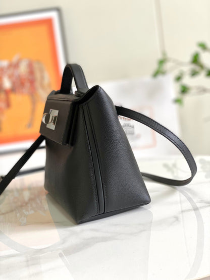 Mini sac HM 24/24 21 cm en cuir noir Evercolor, accessoires argentés