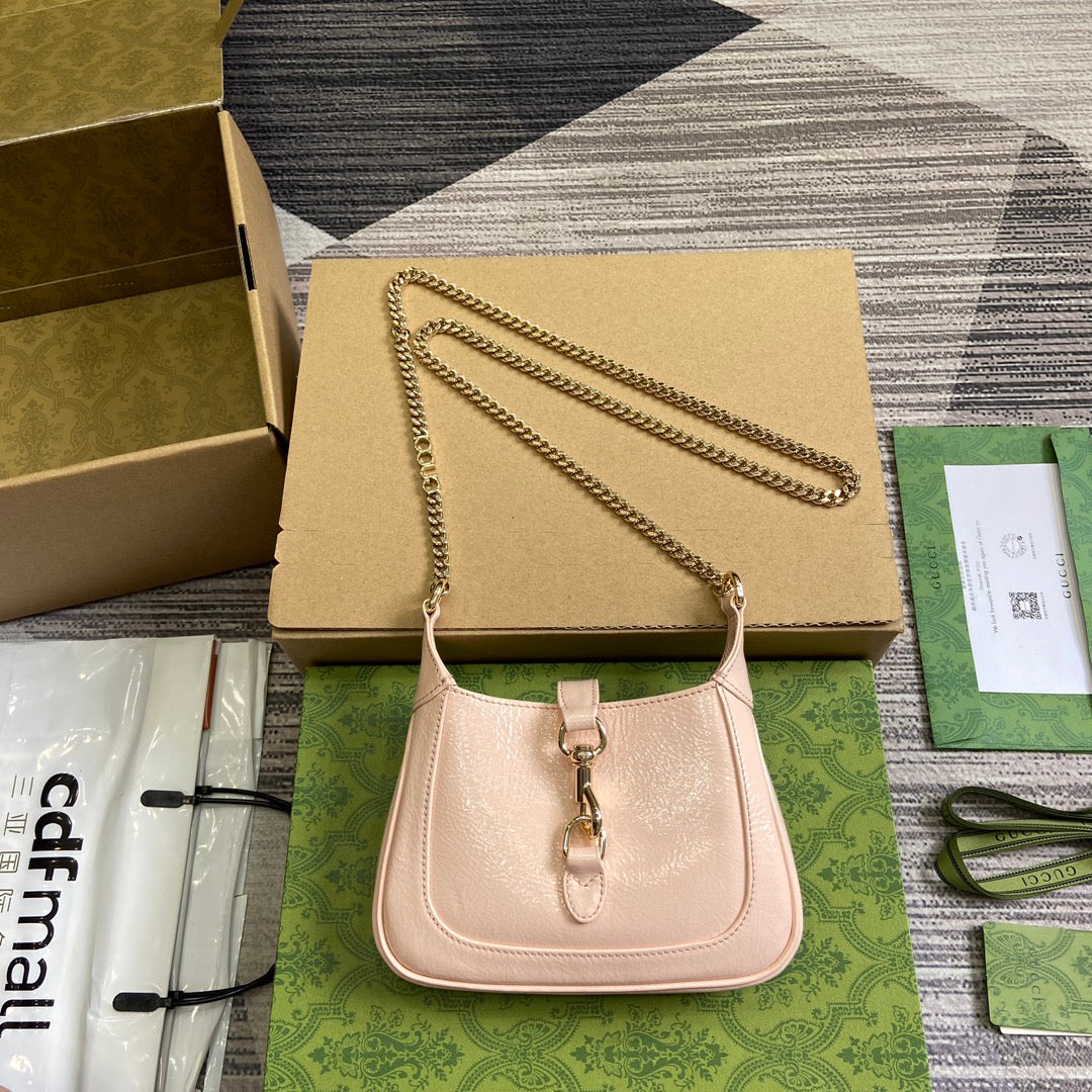 MINI SAC JACKIE NOTTE 19 EN CUIR DE VEAU LAQUÉ CRAQUELÉ ROSE CLAIR, QUINCAILLERIE DORÉE