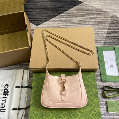 MINI SAC JACKIE NOTTE 19 EN CUIR DE VEAU LAQUÉ CRAQUELÉ ROSE CLAIR, QUINCAILLERIE DORÉE