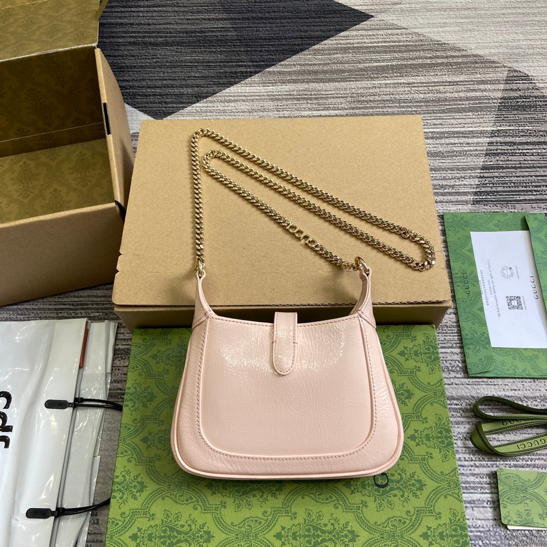 MINI SAC JACKIE NOTTE 19 EN CUIR DE VEAU LAQUÉ CRAQUELÉ ROSE CLAIR, QUINCAILLERIE DORÉE