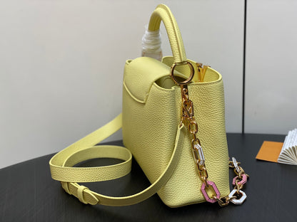 capucines mm 31,5 cuir de taurillon jaune accastillage doré