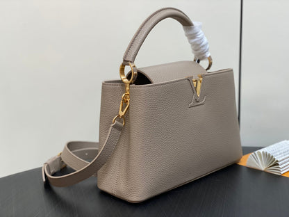 CAPUCINES MM 31 IN KHAKI BROWN TAURILLON