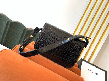 Sac à mors GG 1955 25 cm en cuir de crocodile noir et accessoires dorés