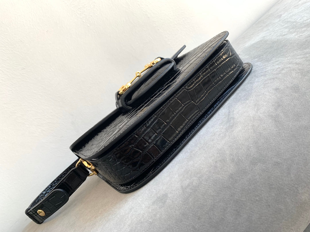 Sac à mors GG 1955 25 cm en cuir de crocodile noir et accessoires dorés