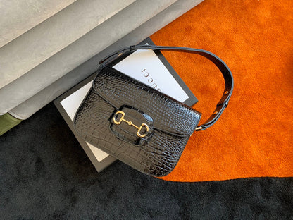 Sac à mors GG 1955 25 cm en cuir de crocodile noir et accessoires dorés